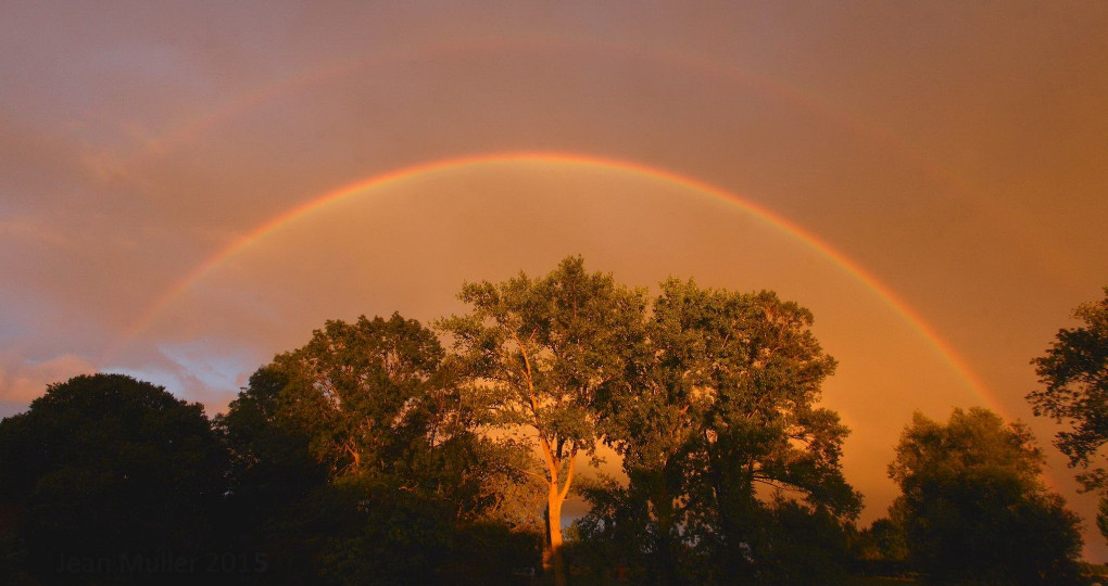 Magnificent rainbow by sunset